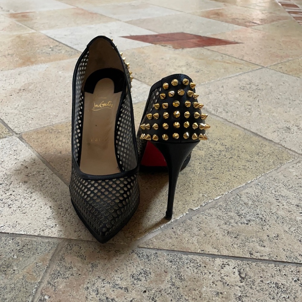 Christian louboutin black pumps with gold spikes.